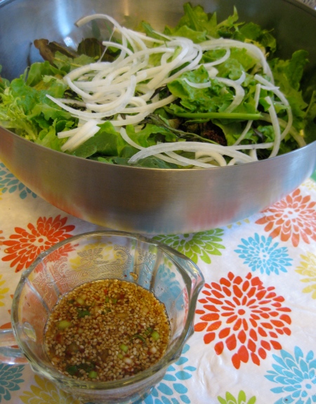 Greens waiting to be tossed in a spicy-soy sauce-sesame oil dressing.