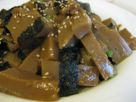 Acorn jelly tosed with sesame seeds and roasted seaweed.
